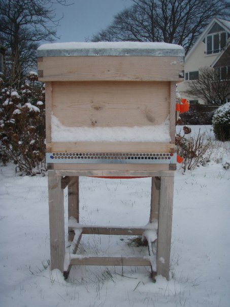 Snow covered bee hive